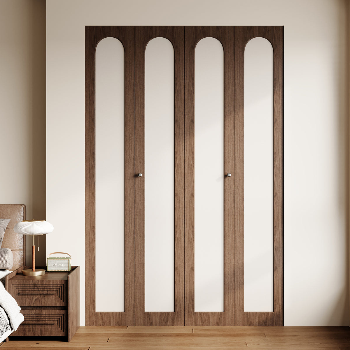 Closed double bi-fold closet doors with dark walnut-colored frames and four cream arched inset panels
