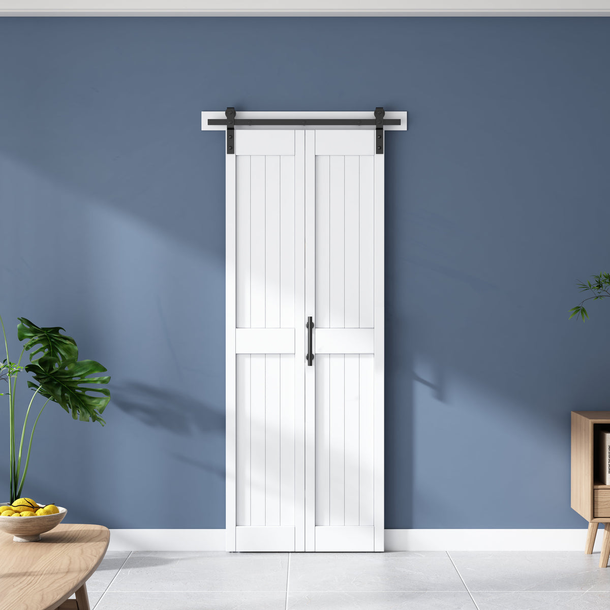 White H-frame bi-fold barn door with a center handle and black sliding track, closed against a blue wall